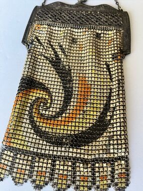 Art Nouveau enamel metal mesh evening bag with swirl design.